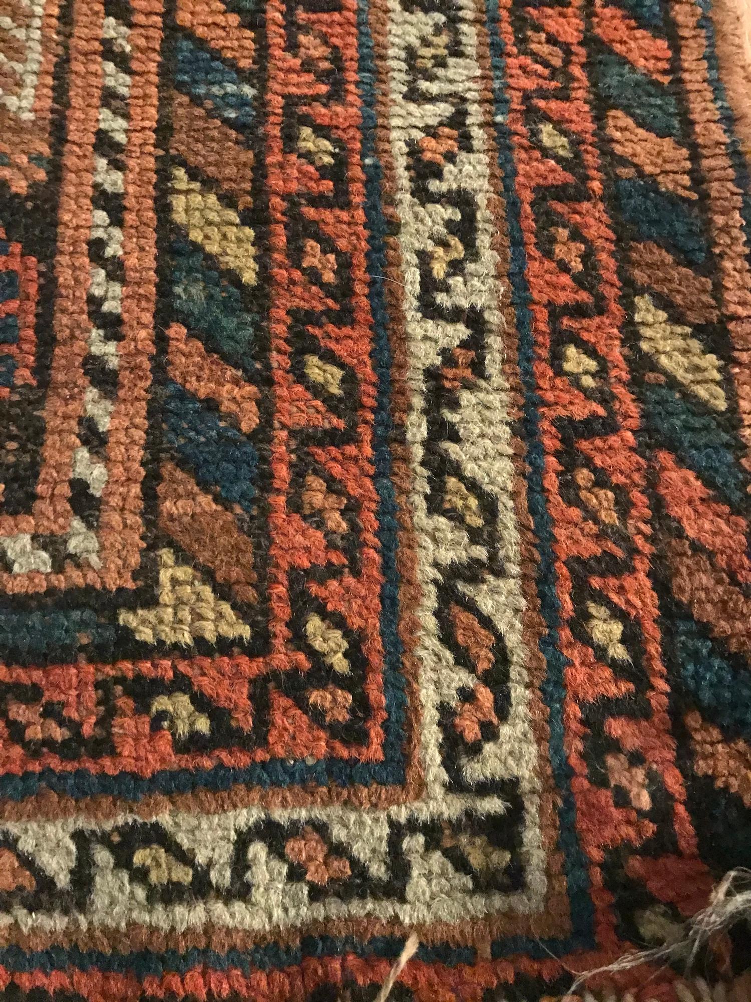 A Small Antique hand woven Indian style rug. Measure 110x97cm - Image 2 of 3