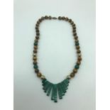 A Beautiful example of a tiger eye, jade and gilt metal ladies necklace.