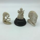 3 early 1900's hand carved ivory figures. Includes a god figure sat upon a wooden base. Measures 6cm