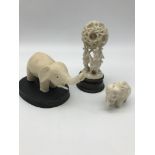 A Lot of 3 early 1900's ivory carved elephant figures. One is designed with 3 elephants holding up a