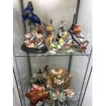 2 shelves of collectable porcelain bird figures which includes Beswick, together with a lot of