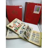 A collection of five stamp albums filled with various stamps