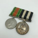 A Service medal of the Order of St John. Plus WW2 Defence medal.