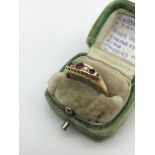 An 18ct gold ladies ring set with 3 Ruby & 2 diamond stones. Originally belonged to Mary Dowson.