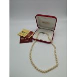 A 24" single strand Majorica pearl necklace in box