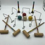 A Vintage miniature Croquet set.