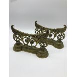 2 Victorian ornate brass and weighted door stops. Measure 14x20x6cm