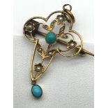 A 9ct gold Art Nouveau pendant/ brooch set with 2 turquoise stones and seed pearls.