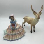 A Royal Doulton Figurine "Day Dreams"Hn 1731 together with a Beswick stag - (AS FOUND).