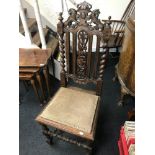 A Victorian highly carved dining chair.