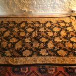 An antique ornate floral design rug. Measures 260x166cm