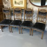 A lot of four antique oak dining chairs in an arts & crafts manner