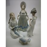 Two Nao girl figurines, a Q'Art.SA lady figurine & a bird figurine completed in a Nao manner