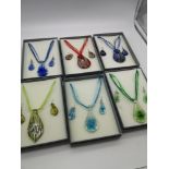 A lot of 6 colourful glass necklace & earring sets within presentation boxes