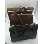 A quantity of four vintage leather bags to include one by designers Mappin & Webb