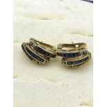 A beautiful pair of 18ct gold earrings set with diamonds and sapphires, 6 grams