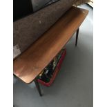 A Retro teak coffee table. Measures 60x110x58cm