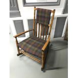 A Lovely arts and crafts rocking chair upholstered in tartan tweed material.