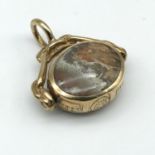 A Sheffield 9ct gold agate swivel fob, stamped with large hallmarks.