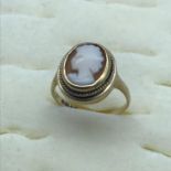 A 9ct gold and cameo set ring, size N.