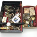 Two tubs filled with various costume jewellery and watches