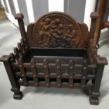 Cast iron antique fire pit. with character backing