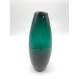 Holmegaard green glass vase. Measures 24cm in height. Signed to the base.