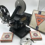 A Vintage Astor 22 home cinema projector. Comes with four 9.5mm films which includes 3 Disney