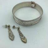 A Silver Art Deco style bangle with silver Art Deco style earrings