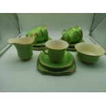 A 19 piece Royal Winton Grimwades tea set in a green and gilt design, with sugar & cream