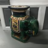 A Large Ceramic elephant stool/ planter stand. Measures 61x64x27cm