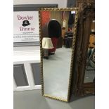 A Full length mirror fitted with a gilt frame, Measures 124x42cm
