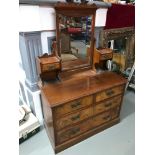 A Victorian 2 over 2 chest of drawers fitted with dressing table mirror and small drawers