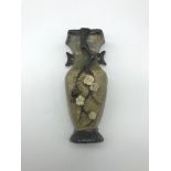 Antique hand made oriental clay wall vase. Measures 16.5cm in height.