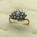 A 9ct gold ladies CZ cluster ring, size N.