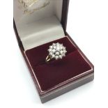 A Beautiful example of a 9ct gold and Diamond cluster ring. 1.00ct of diamonds. Ring size K.