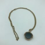 A 9ct gold chain together with a Birmingham 9ct gold agate swivel fob, 12 grams