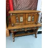 A Solid oak Renaissance style carved front 2 door, 2 drawer sideboard/ dresser. Detailed with