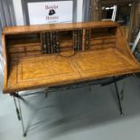 A Reproduction fully brown leather top writing desk designed with various small drawers and 2 book