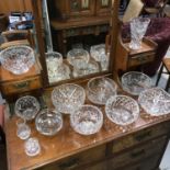 A Collection of cut crystal bowls and vases.