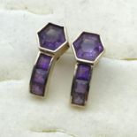 A pair of 14ct gold earrings set with four amethyst stones, 4 grams