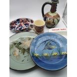 A mixed lot of collectable porcelain to include, Quimper plate, Stoneware plate, Smirnoff Vodka