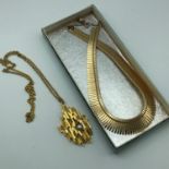 A Vintage abstract pendant with single pearl, together with a Vintage gilt metal necklace