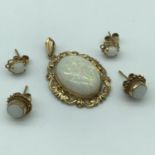 A lovely example of a 9ct gold and large opal stone pendant, together with two pairs of 9ct gold and