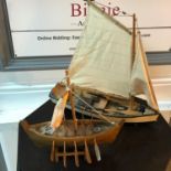 Vintage rowing boat model and Viking style boat model.