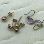 A Lot of various scrap gold earrings, to include; gold and amethyst stone earrings, 2 Grams