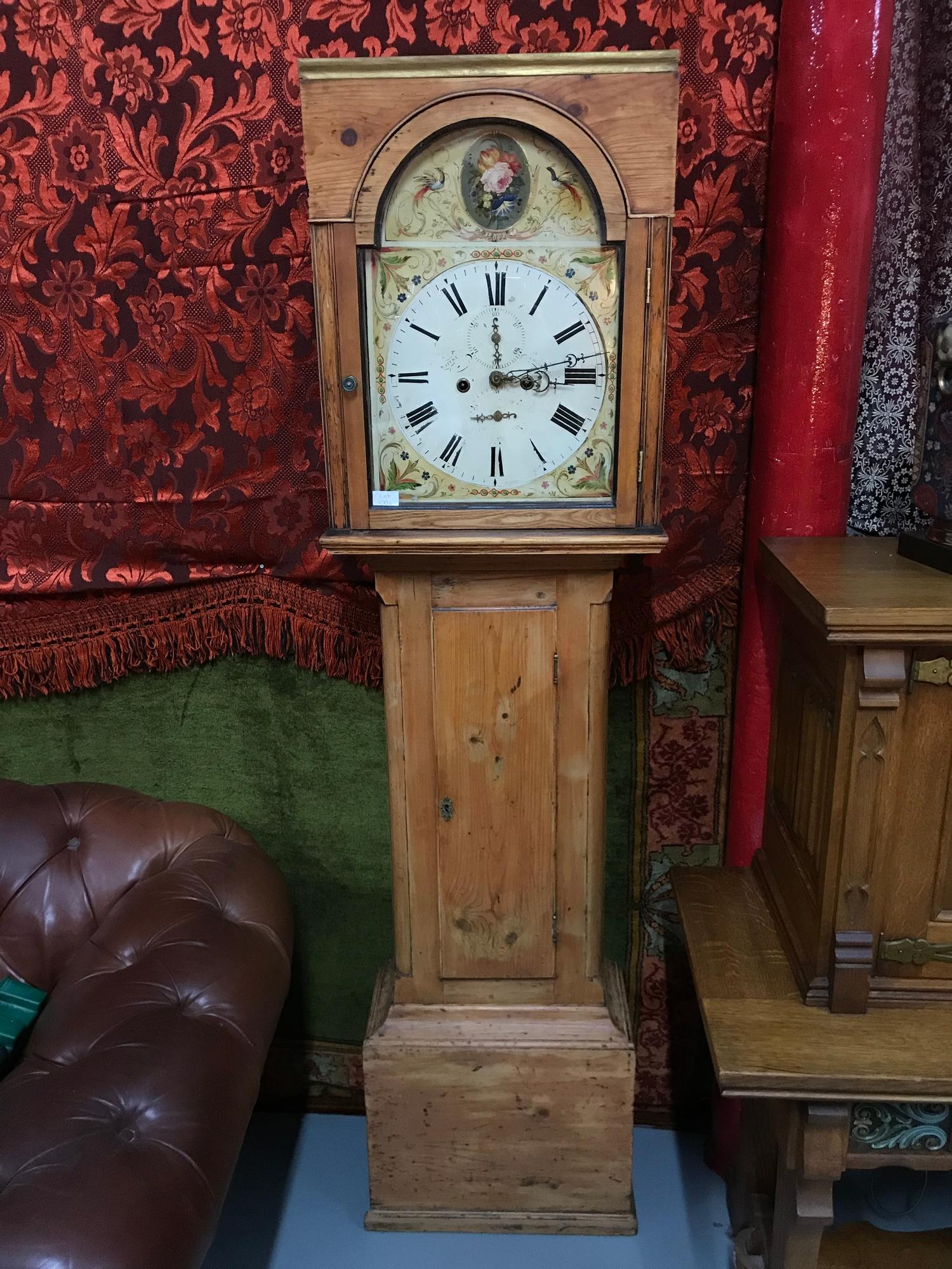 A Victorian pine cased grandfather clock, hand painted face, Maker D.Aitken. Comes with weights,