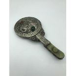 A Chinese white metal, jade and hard stone hand mirror. Measures 23cm in length