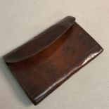 A Vintage Harrods Ltd, London leather fishing wallet with various sealed hooks etc.