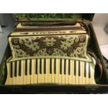 Early 1900 Scandalli Scott Wood Four mother of pearl accordion with travel case.